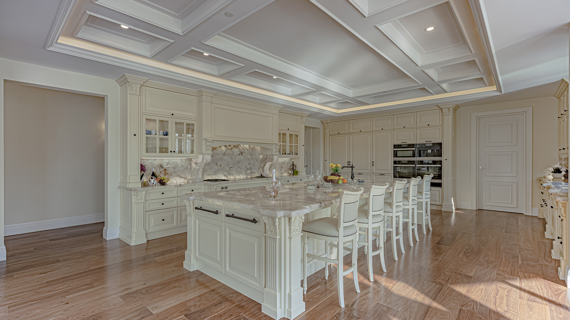 Altamont's Muse kitchen with bar seating and custom cabinetry in West Vancouver