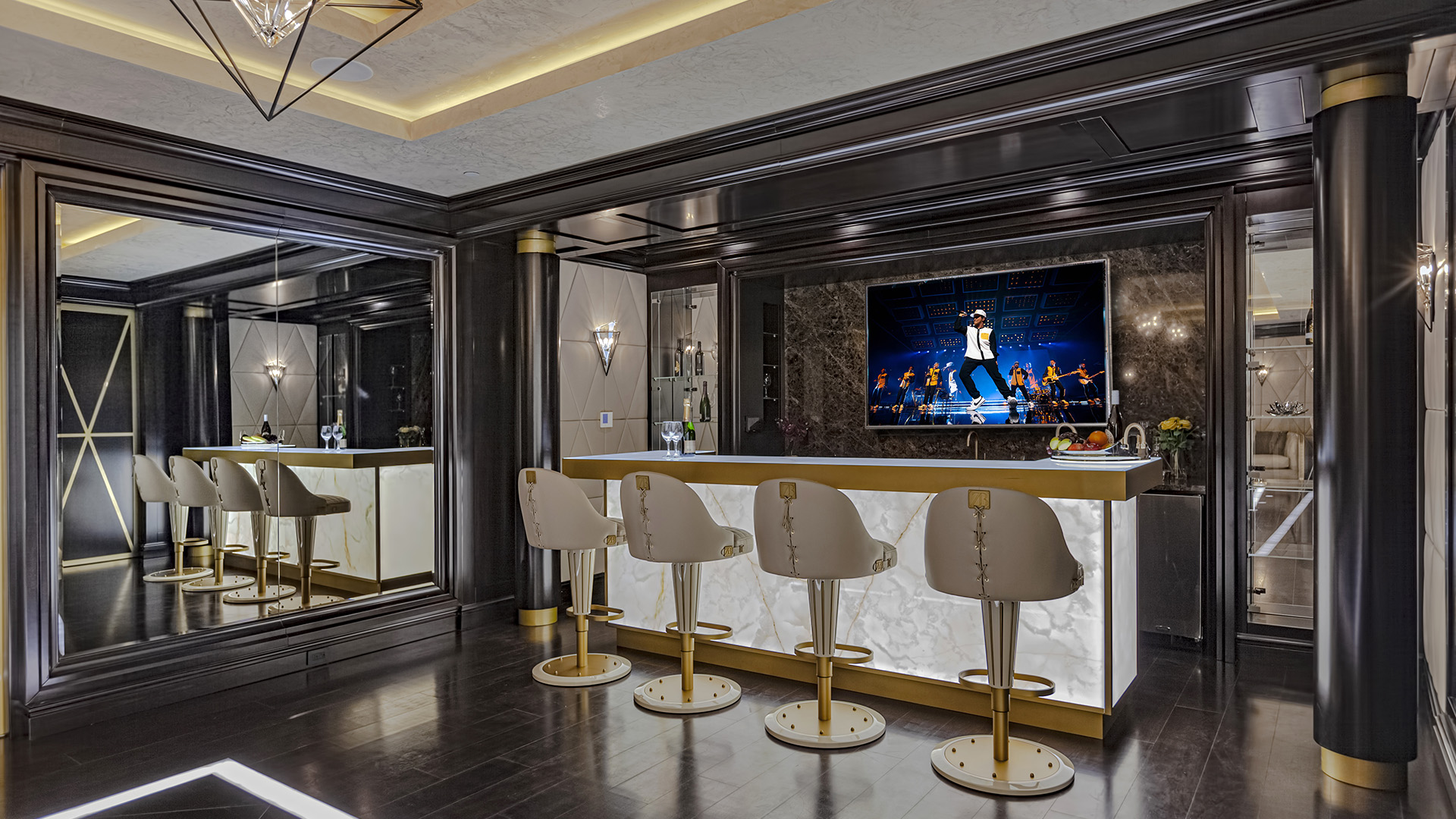 Altamont's Muse bar area with designer stools and entertainment screen in West Vancouver