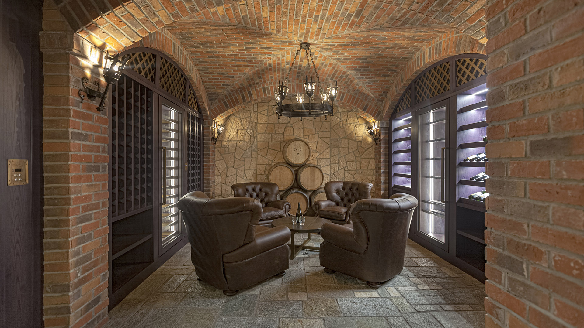 Altamont's Muse wine cellar with brick vaults and leather seating in West Vancouver