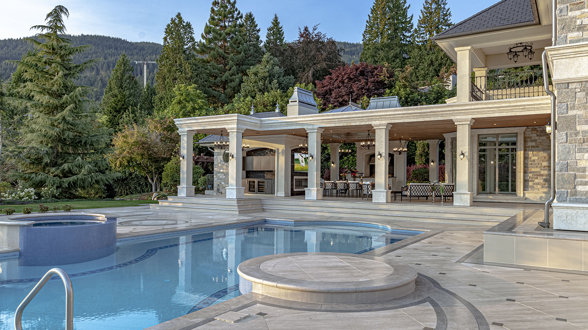 Altamont's Muse pool area with hot tub and mountain views in West Vancouver