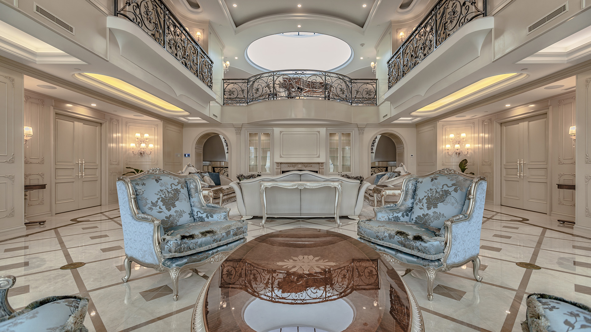 Ambleside Palace symmetrical grand salon with oval skylight and ornamental ironwork balustrade in West Vancouver