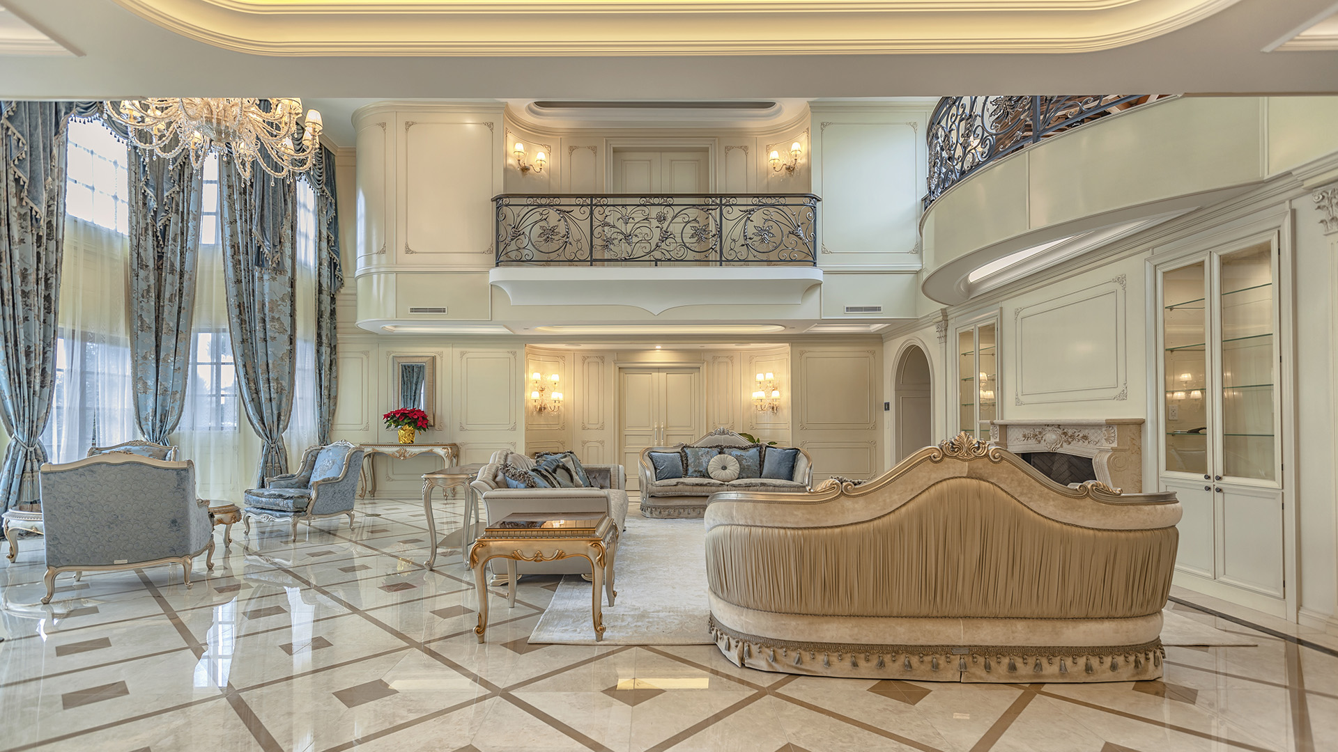 Ambleside Palace formal living room with custom millwork paneling and carved marble fireplace in West Vancouver