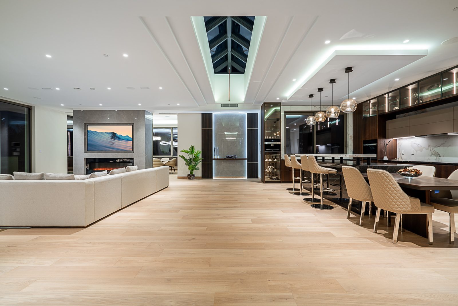 Entry foyer with nero marquina black marble floor floating staircase and sputnik chandelier luxury West Vancouver home