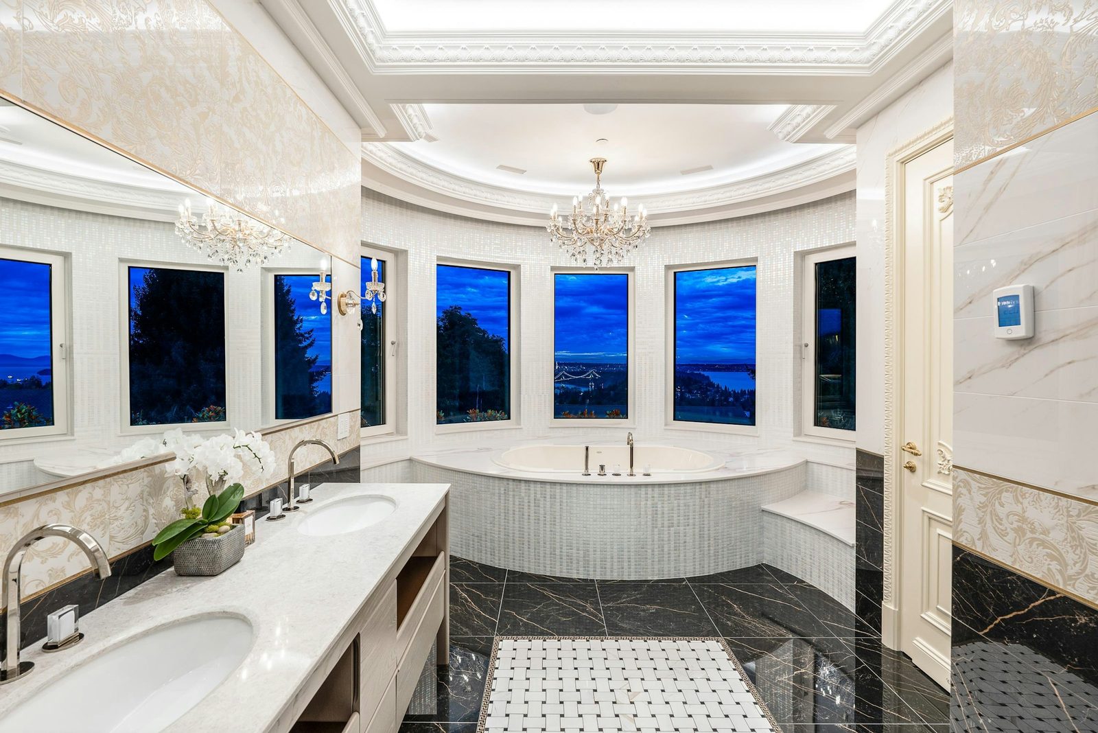 Master ensuite bathroom with soaking tub and panoramic Vancouver harbour views at Montbeau Eyremount