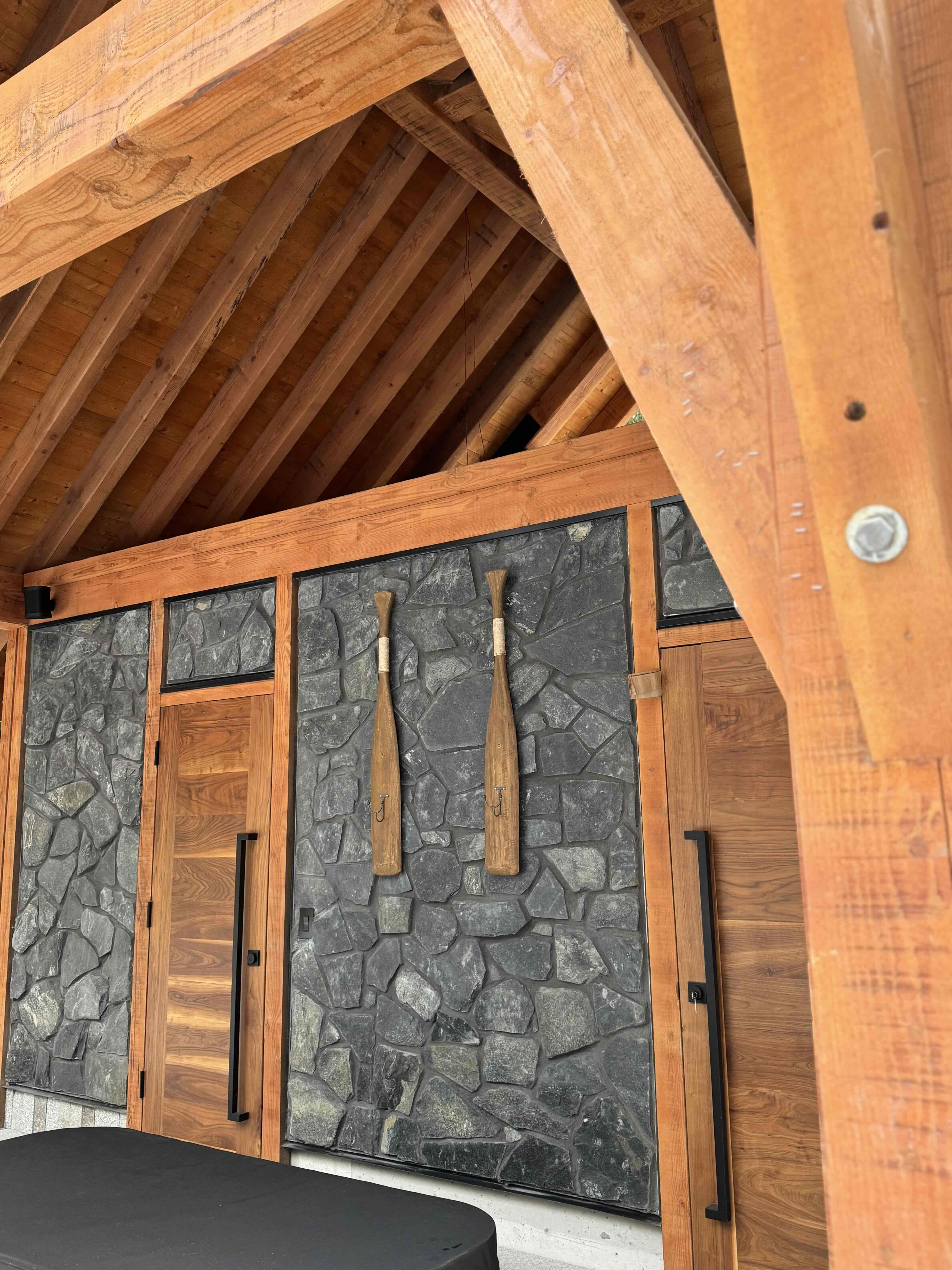 Outdoor kitchen gazebo with timber post-and-beam structure, steel connectors, and BBQ area at Rainbow in Whistler by Eurohouse Construction