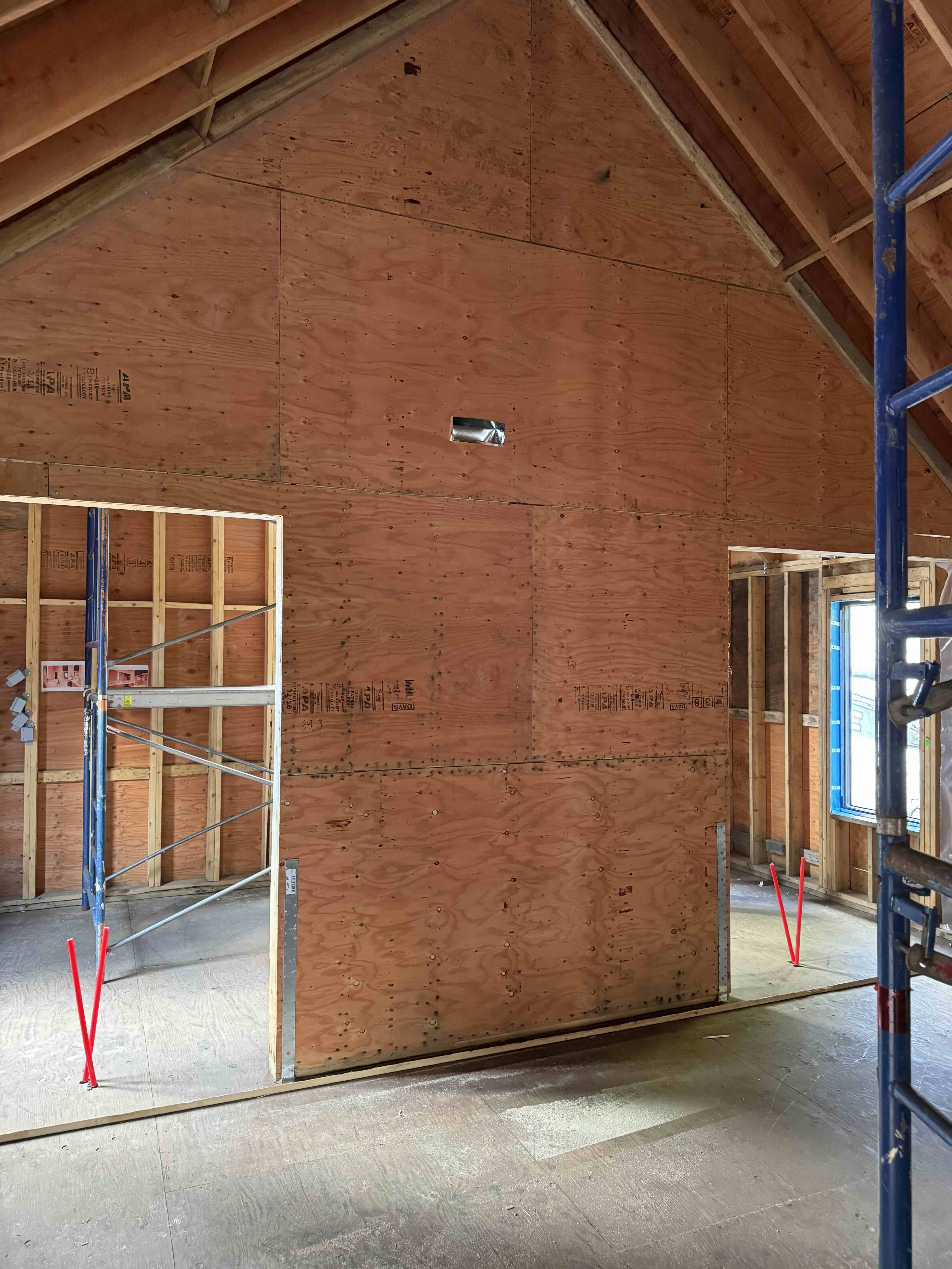 Interior framing showing barn vault ceiling structure at Scandinavian barn house West Vancouver by Eurohouse Construction