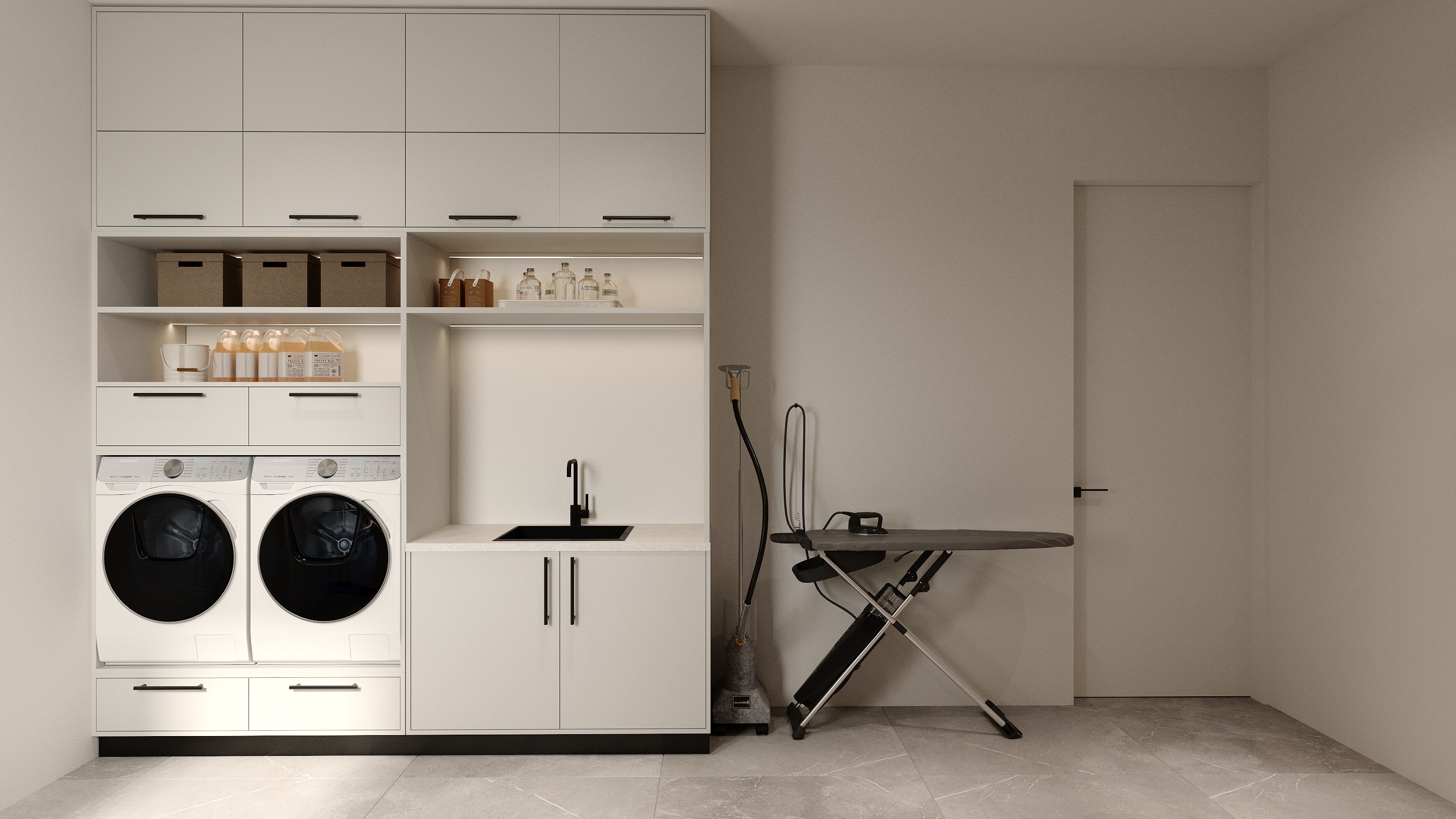 Laundry room with custom cabinetry at Scandinavian barn house West Vancouver by Eurohouse Construction
