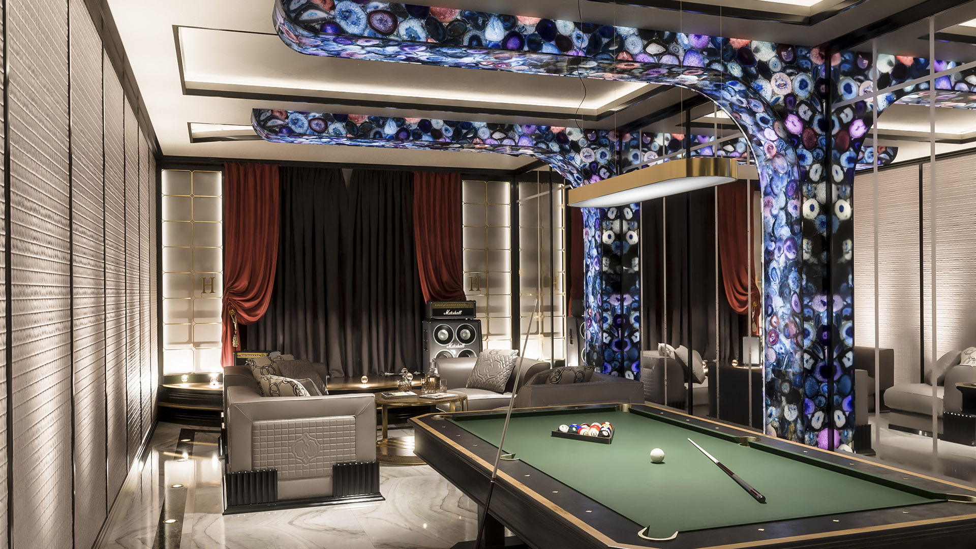 Entertainment lounge with backlit Brazilian agate stone ceiling installation, professional billiard table, Marshall amplifier, and lounge seating in The H House West Vancouver luxury estate