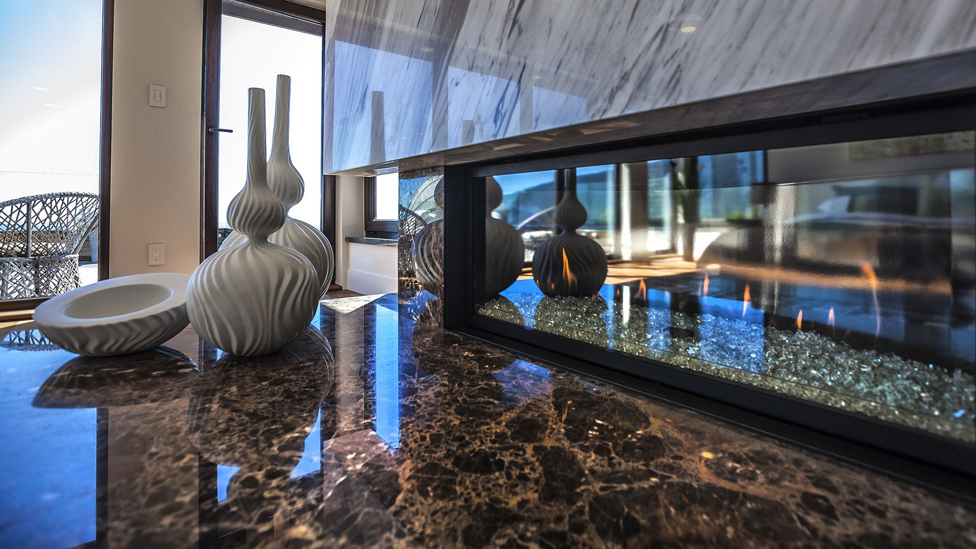 Master fireplace detail showing polished marble surround linear gas flame and granite hearth West Coast Contemporary British Properties West Vancouver